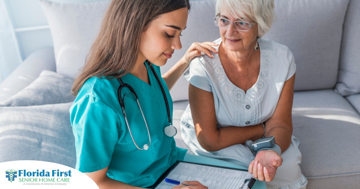 A nurse checks on the vitals of a senior patient at home, showing part of the home health monitoring process.