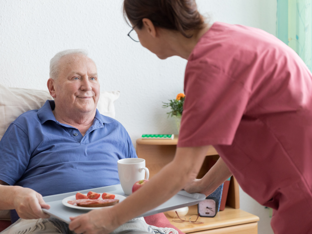 caregiver helping with meal preparation