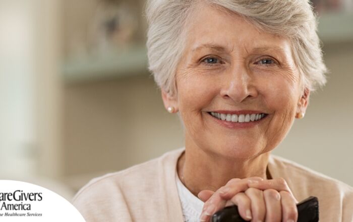 An older woman with healthy teeth smiles, representing good dental hygiene.