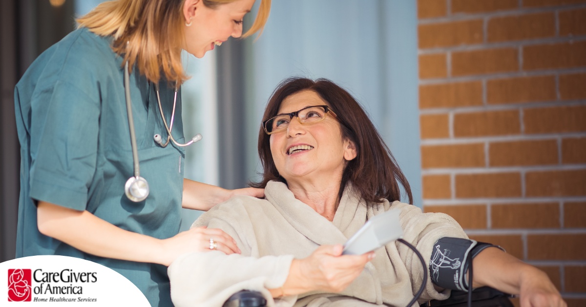 A happy home nurse helps a smiling patient in a wheelchair, representing how home health can help with pain management.