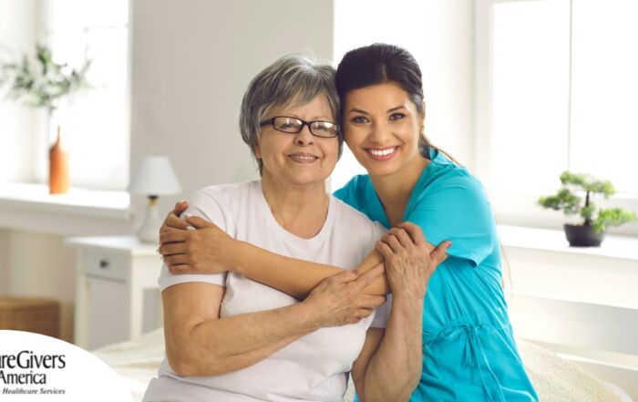 A caregiver hugs an older client, representing how a trustworthy caregiver cares for clients.