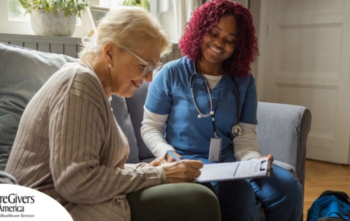 A healthcare professional helps an older patient fill out a form, representing what happens when the requirements for home health care eligibility are met.