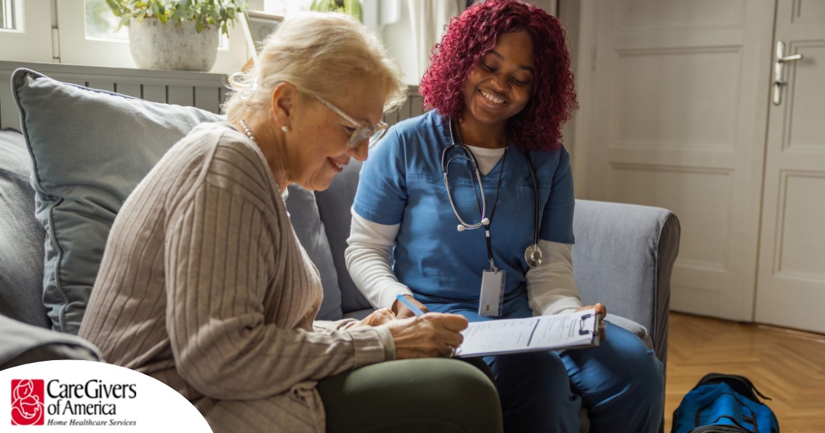 A healthcare professional helps an older patient fill out a form, representing what happens when the requirements for home health care eligibility are met.