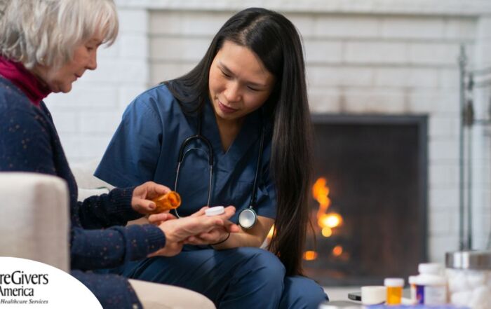 A nurse helps a patient at home with her medications, representing how home health nurses can help with disease management.