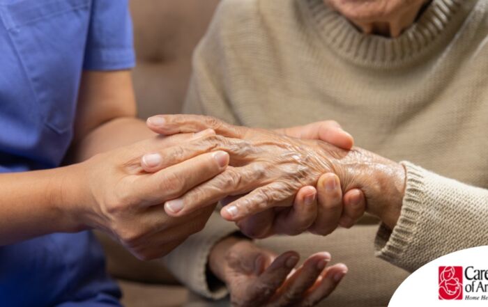A care provider examines an older adult’s fingers, representing what would happen in an examination for rheumatoid arthritis.