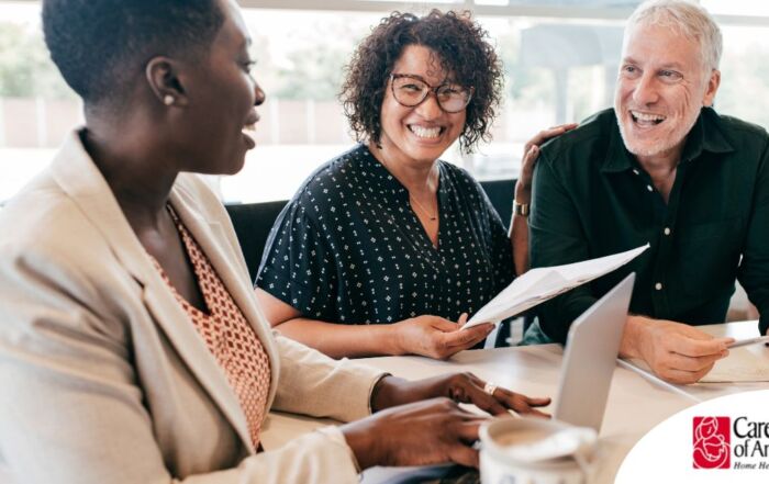 A couple talks with and advisor, representing the type of preparation that is crucial for successful senior care planning.