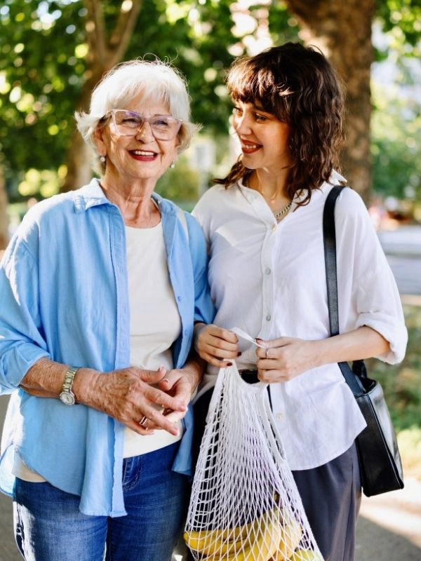 caregiver running errands with senior woman