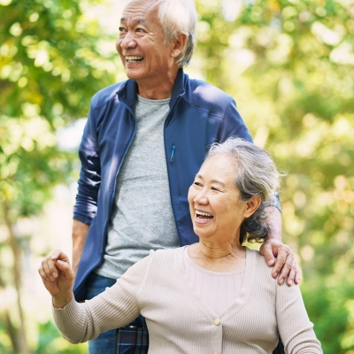 An elderly couple smiles and enjoys time outdoors, reflecting the joy, comfort, and companionship provided through compassionate home care in Wilton Manors.