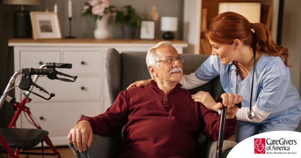 A caregiver helping a woman with a walker make her senior home safer.