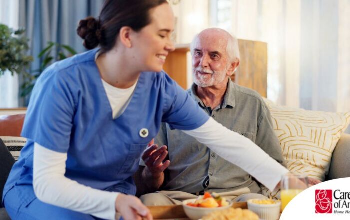 Caregiver providing senior care at home to manage parkinson’s and related symptoms.