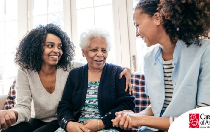 Caregiver talking to a family about Elderly Care