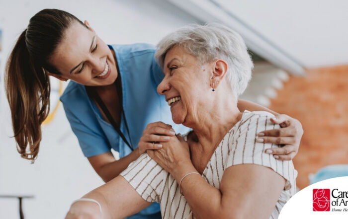 A female caregiver helping an older woman with stroke recovery at home.